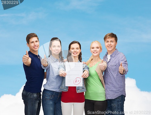 Image of group of students showing test and thumbs up