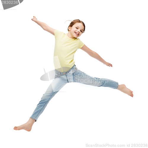 Image of smiling little girl jumping