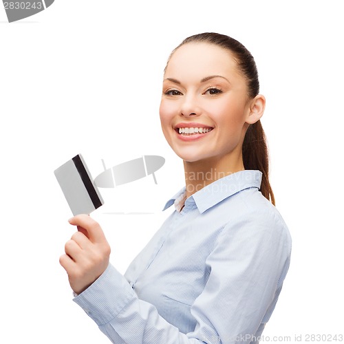 Image of smiling businesswoman showing credit card