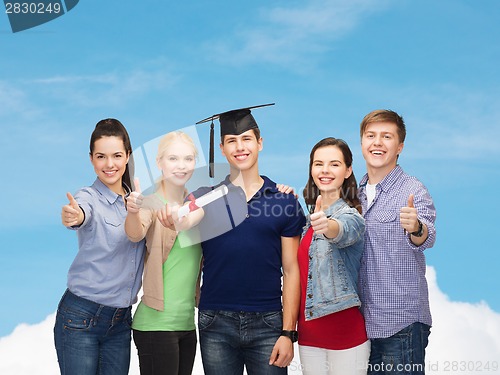 Image of group of students with diploma showing thumbs up