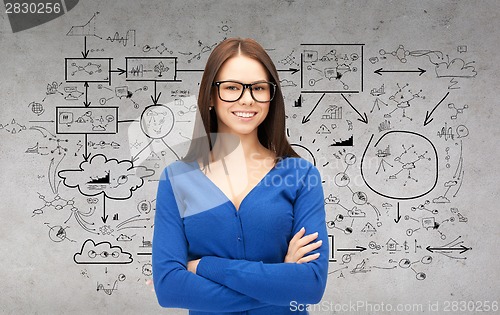 Image of smiling businesswoman or student in glasses