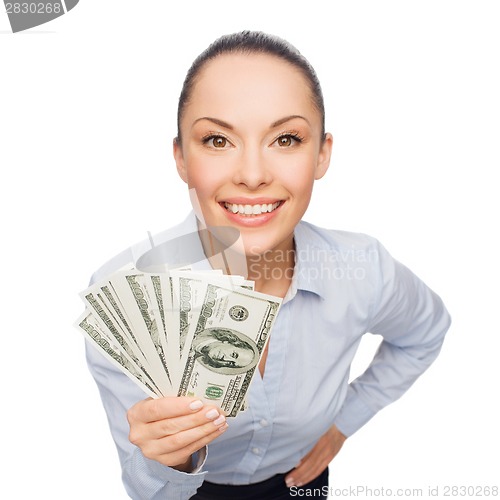 Image of smiling businesswoman with dollar cash money