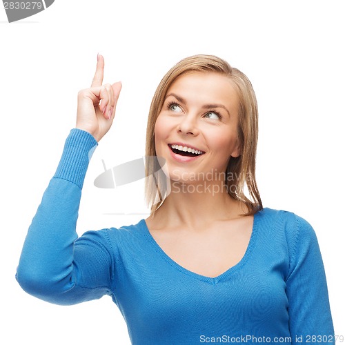 Image of smiling woman pointing her finger up