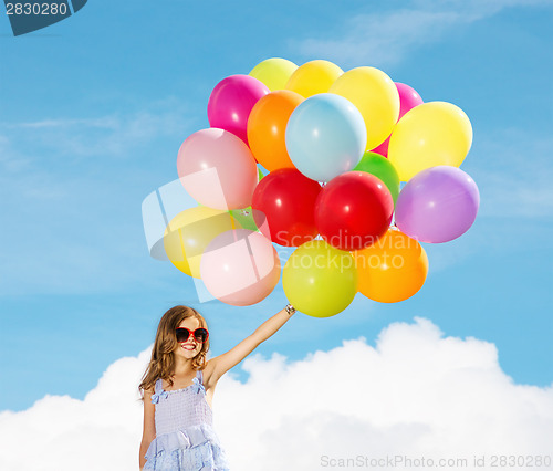 Image of happy girl with colorful balloons