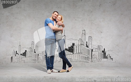 Image of smiling couple hugging and looking at each other