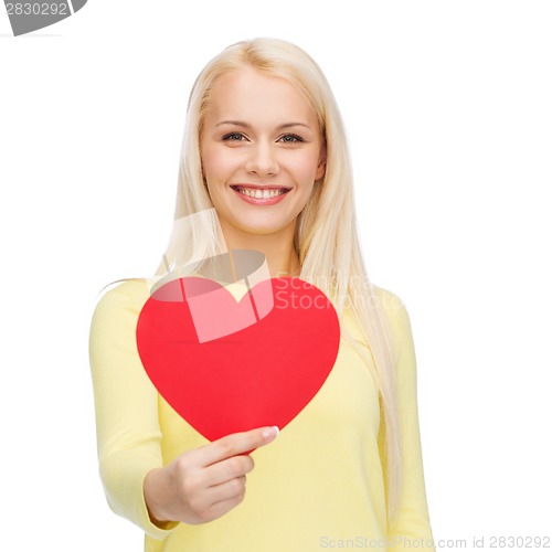 Image of smiling woman with red heart