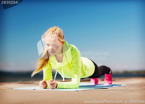 Image of woman doing sports outdoors