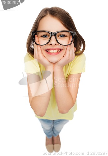 Image of smiling cute little girl in black eyeglasses