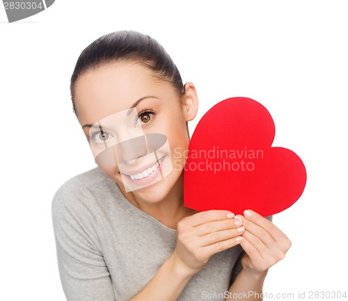 Image of smiling asian woman with red heart