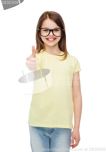 Image of smiling cute little girl in black eyeglasses