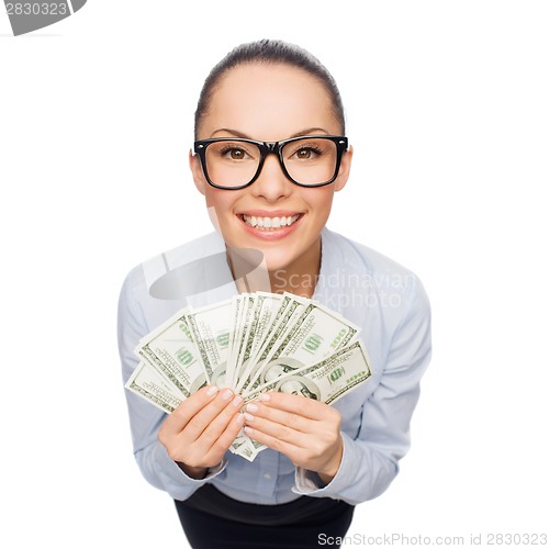 Image of smiling businesswoman with dollar cash money