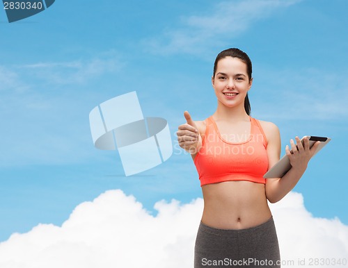 Image of sporty woman with tablet pc computer
