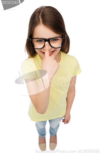 Image of smiling cute little girl in black eyeglasses