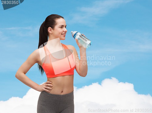 Image of sporty woman with water bottle