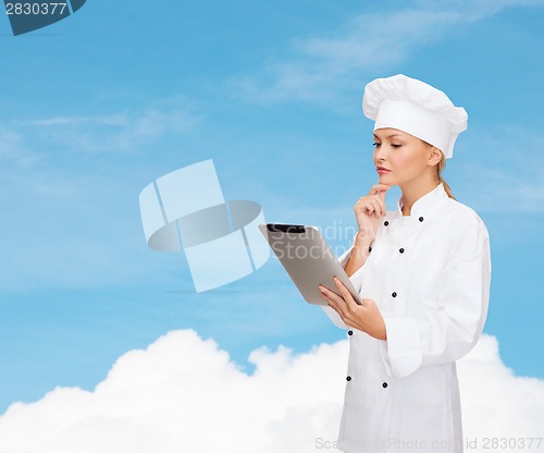 Image of smiling female chef with tablet pc computer