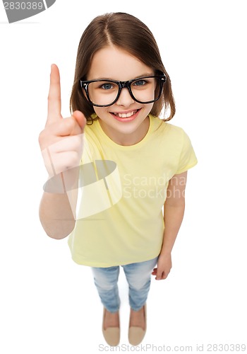Image of smiling cute little girl in black eyeglasses