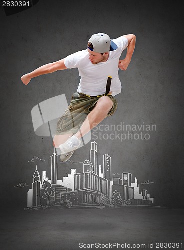 Image of male dancer jumping in the air