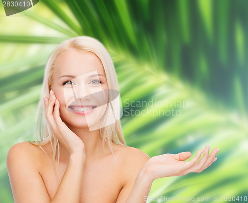 Image of smiling woman holding imaginary lotion jar