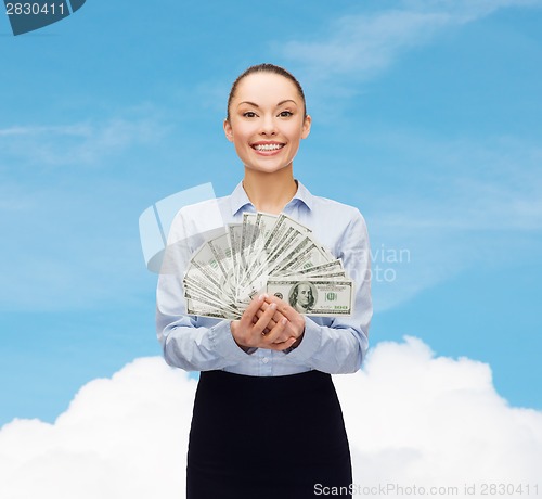 Image of young businesswoman with dollar cash money