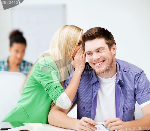 Image of group of students gossiping at school