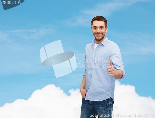 Image of smiling man showing thumbs up