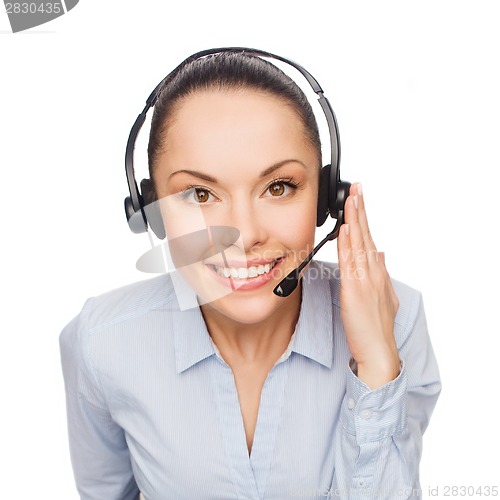 Image of friendly female helpline operator with headphones