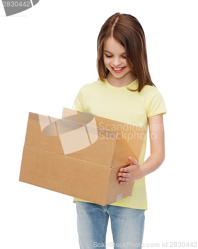 Image of smiling little girl with many cardboard boxes