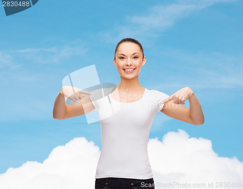 Image of smiling woman in blank white t-shirt