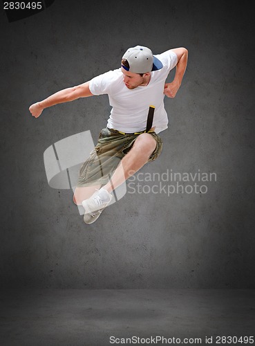 Image of male dancer jumping in the air