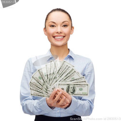 Image of young businesswoman with dollar cash money