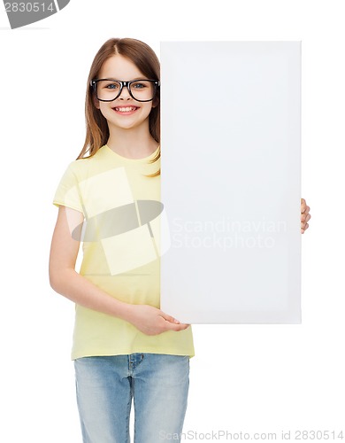 Image of little girl wearing eyeglasses with blank board