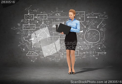 Image of smiling businesswoman with folder