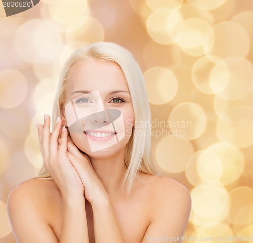 Image of face and hands of happy woman