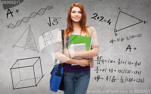 Image of smiling student with bag, folders and tablet pc