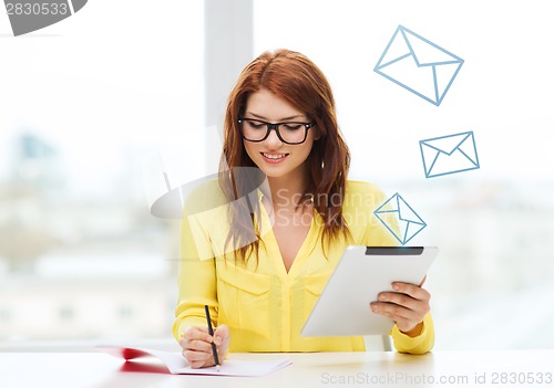 Image of student with tablet pc computer and notebook