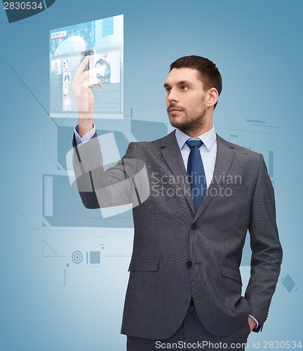 Image of young businessman with smartphone