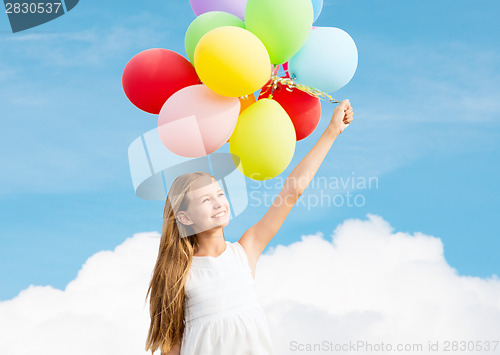 Image of happy girl with colorful balloons