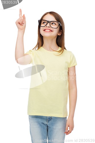 Image of smiling cute little girl in black eyeglasses