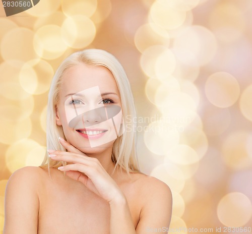 Image of face and hands of beautiful woman