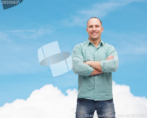 Image of smiling man with crossed arms