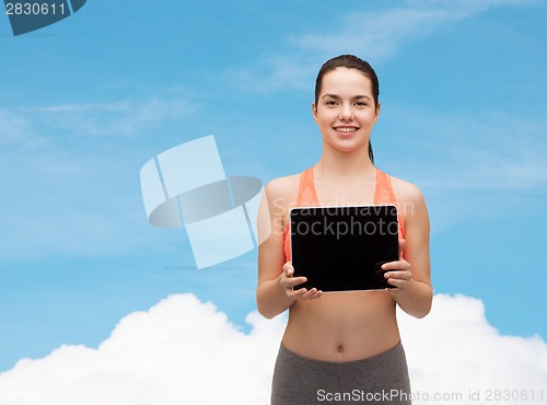 Image of sporty woman with tablet pc blank screen
