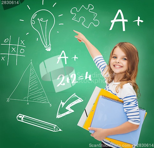 Image of cute girl with folders pointing to green board