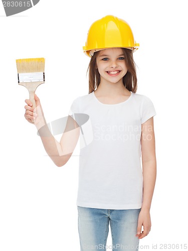 Image of smiling little girl in helmet with paint brush