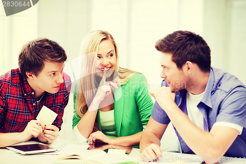 Image of group of students gossiping at school