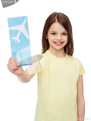 Image of smiling little girl with airplane ticket