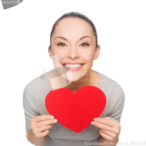 Image of smiling asian woman with red heart