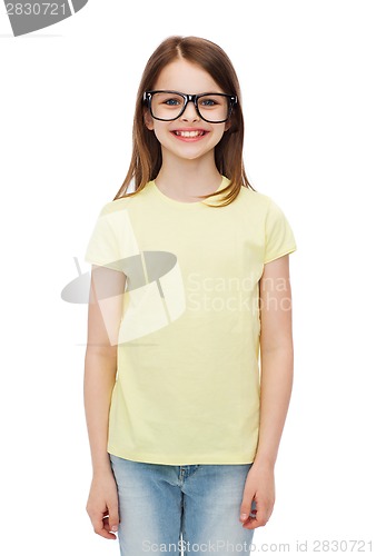 Image of smiling cute little girl in black eyeglasses