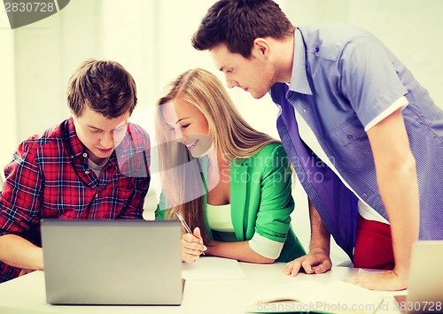 Image of students writing test or exam in lecture at school