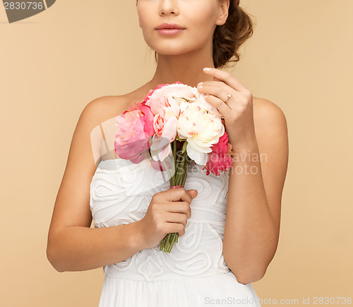 Image of woman with bouquet of flowers