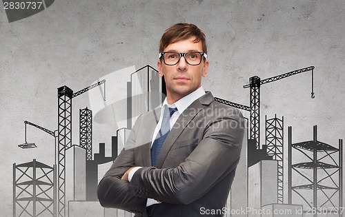 Image of attractive businessman or teacher in glasses